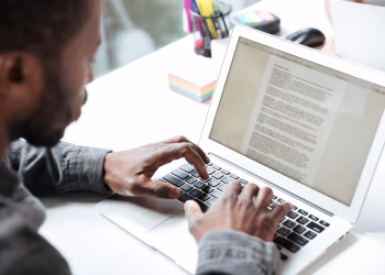 A young man using a laptop