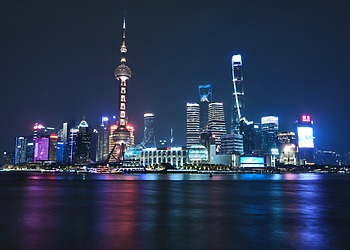 ESG news regarding China and India expanding green hydrogen production with state support, UK easing EV charging rules to boost home electrification and cut energy costs, Queensland funding renewable diesel project to strengthen fuel security, and Welsh farmers suing energy developer over pylon route and biosecurity allegations.