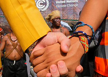 International Cooperation and Evolutionary Altrusim: Can We Evolve in Time to Save the Planet?