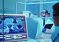 wo laboratory researchers analyzing medical imaging data on a clinical computer screen showcasing custom AI healthcare software solutions.
