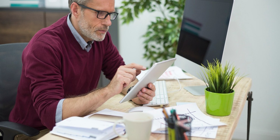 small business owner working on his accounts.