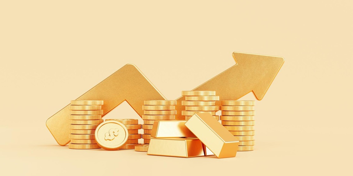 Stack on assets such as gold bar and coins with a orange background and large arrow trending upwards.
