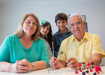 Three generations of a family in a sustainable home