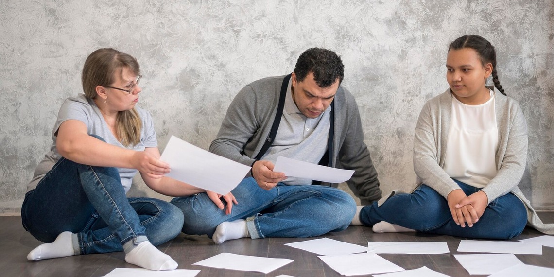 Parents sifting through document of their legal dispute with the school.