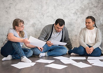 Parents sifting through document of their legal dispute with the school.