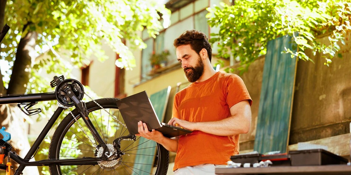 Man browsing the web on his laptop via local internet provider