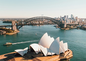 ESG news regarding Australia’s lawsuit against 3M over PFAS contamination, economic risks linked to extreme heat in Germany, TotalEnergies’ offshore wind expansion in Normandy, and a U.S. safety probe into Rivian electric vehicles.