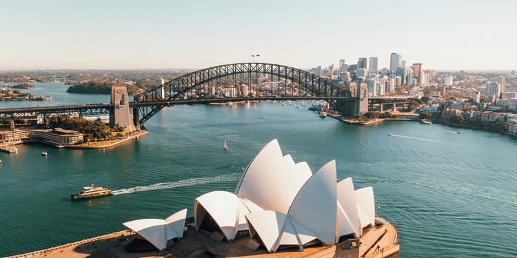 ESG news regarding Australia’s lawsuit against 3M over PFAS contamination, economic risks linked to extreme heat in Germany, TotalEnergies’ offshore wind expansion in Normandy, and a U.S. safety probe into Rivian electric vehicles.