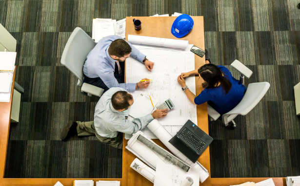 Team working around a rectagular table - view from above them