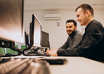 Two Developers doing tech Support
