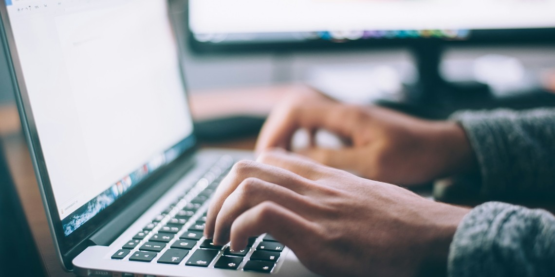 Person working on a laptop computer