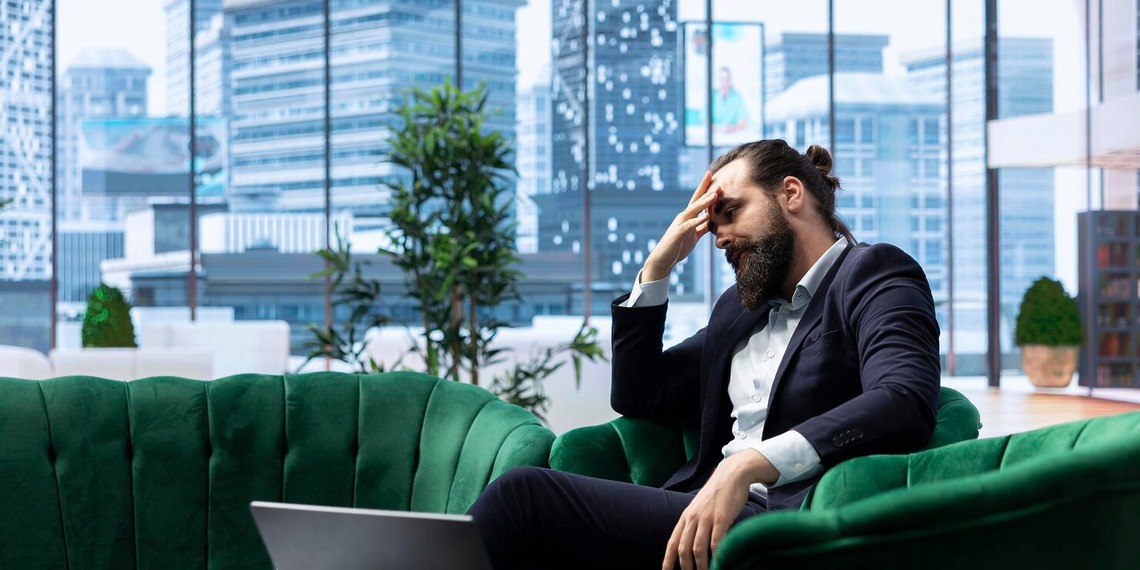 Business owner reviewing financial documents while facing operational and regulatory challenges in the CBD industry.