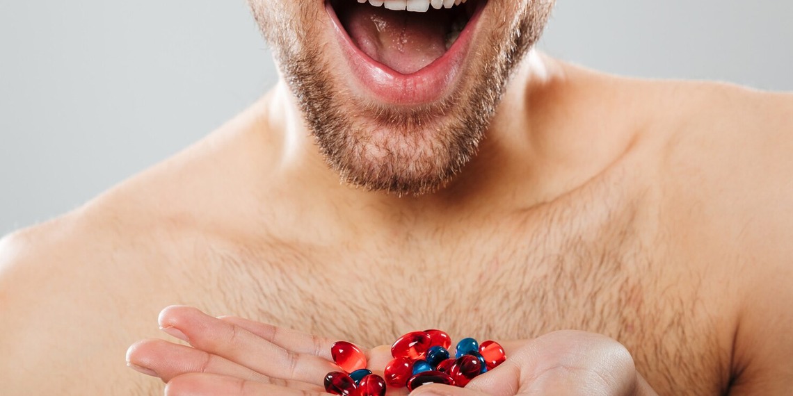Man holding plant-based dietary supplements associated with natural testosterone support and men's health.