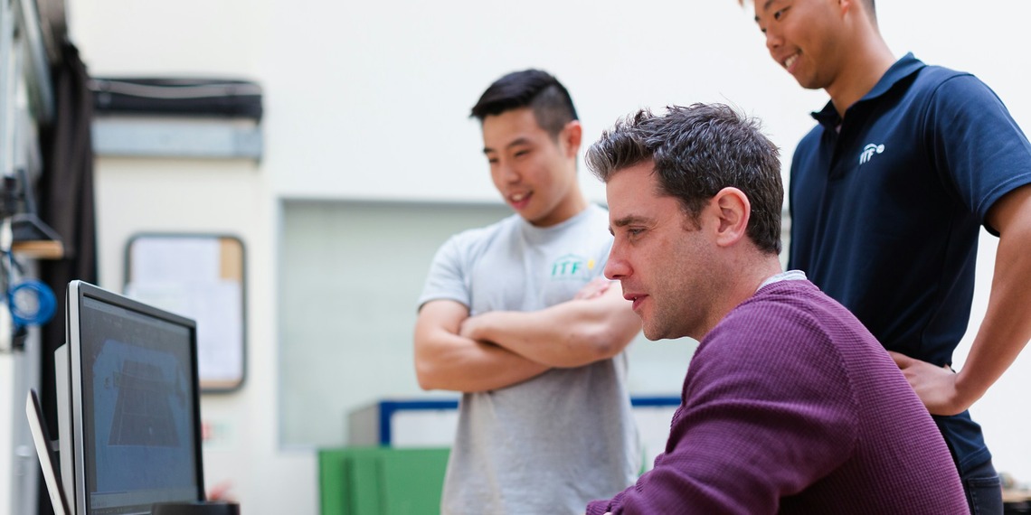Software engineers collaborating on enterprise software development in a modern technology workspace.