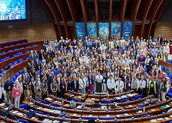 A group of people gather for a photo at the Council of Europe's headquarters in Strasbourg, France.