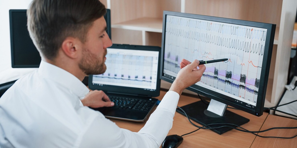 Finance professional using budget forecasting software to analyze financial data and improve business planning.