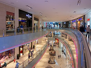 storefronts and people strolling in the Dubai mall