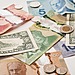 U.S. and Canadian currencies on a white table.