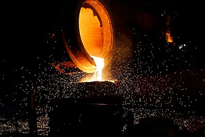 Glowing hot metal being poured.