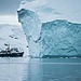 Ship sailing near an iceberg in Arctic waters