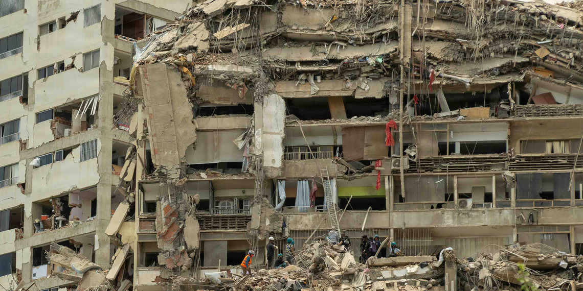 Venezuelan citizens search destroyed buildings in La Guaira, Venezuela