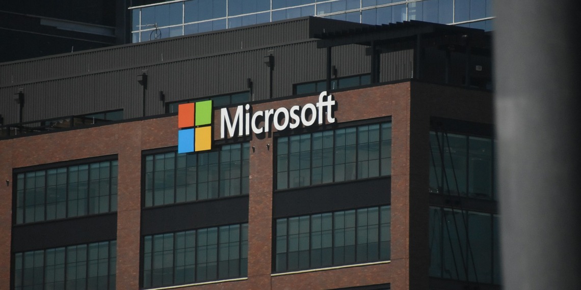 The Microsoft logo on a brown office building