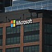 The Microsoft logo on a brown office building