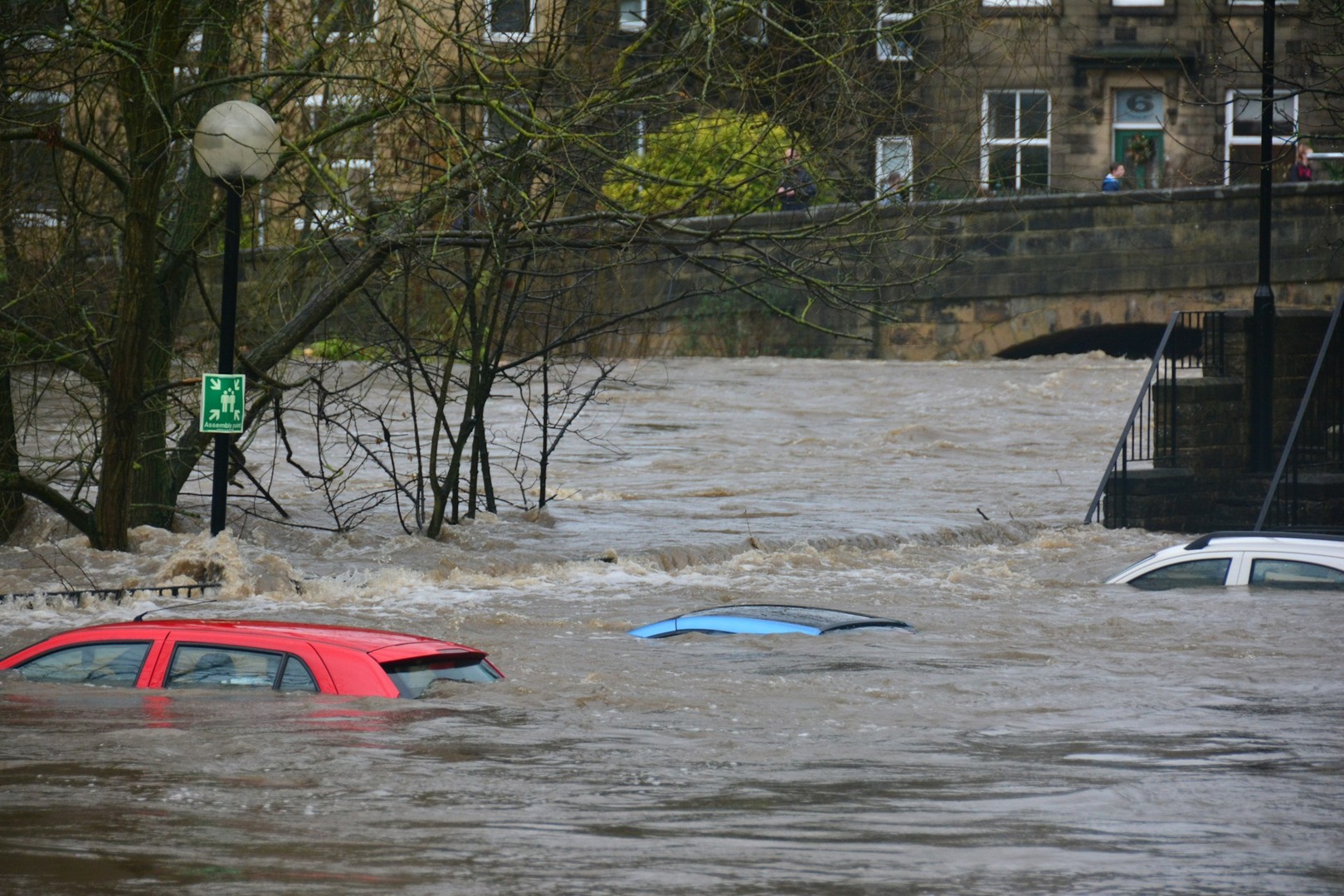 Floods in Bradford, UK, 2015. A shot features cars almost completely under water