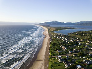 Buildings lining the coast next to the ocean
