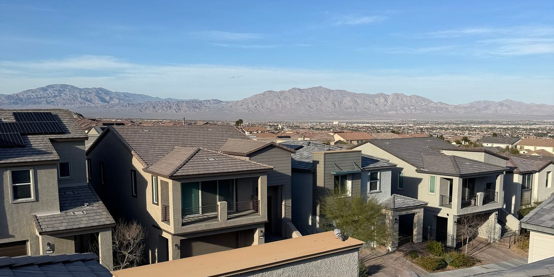 Suburban rooftops in Las Vegas under a clear blue sky