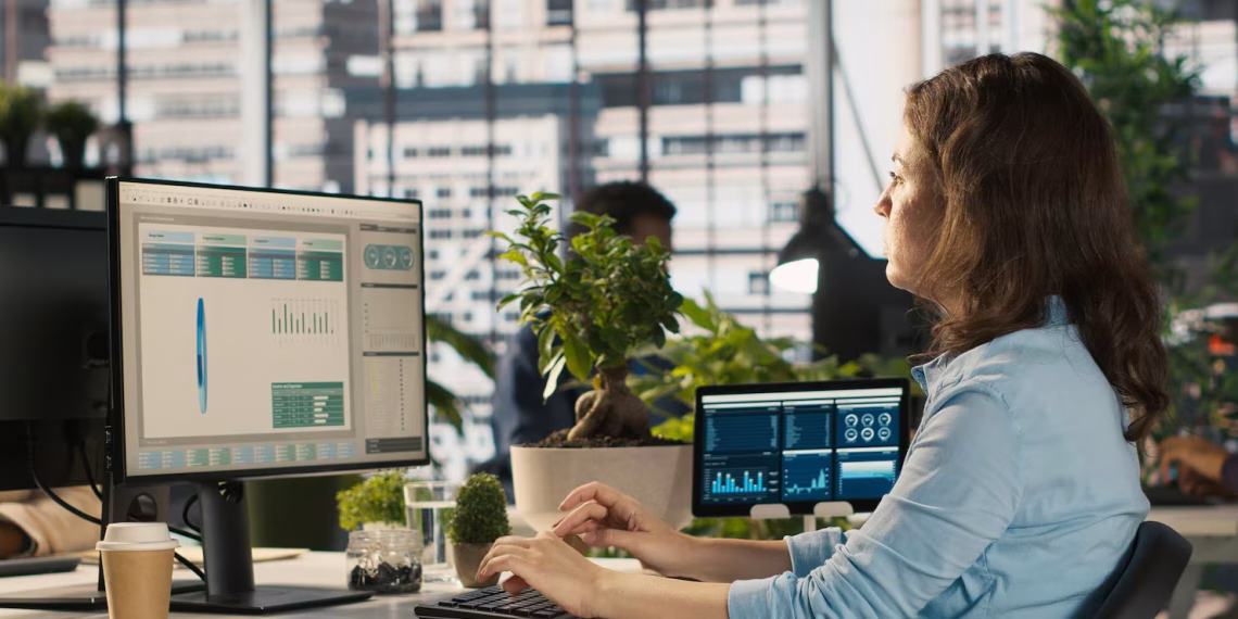 Finance professional using digital dashboards for factoring and accounts receivable management