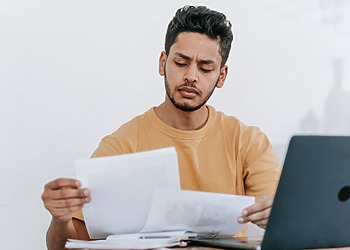 Tax student looking over his text books.