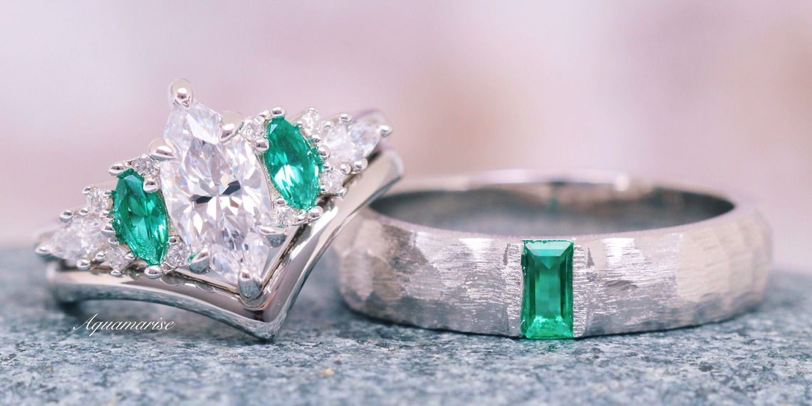 Two complementary couples rings with clear and green gemstones