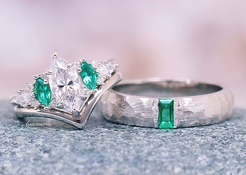 Two complementary couples rings with clear and green gemstones