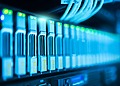 Detailed image of a server rack with glowing lights in a modern data center.