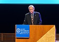 Geoffrey Hinton behind a speaker’s platform, accepting the Nobel Prize in 2024