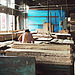 A skilled woodworker carefully grades veneer by eye for its beauty and appearance.