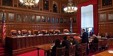 A New York courtroom, where judgments are pronounced.