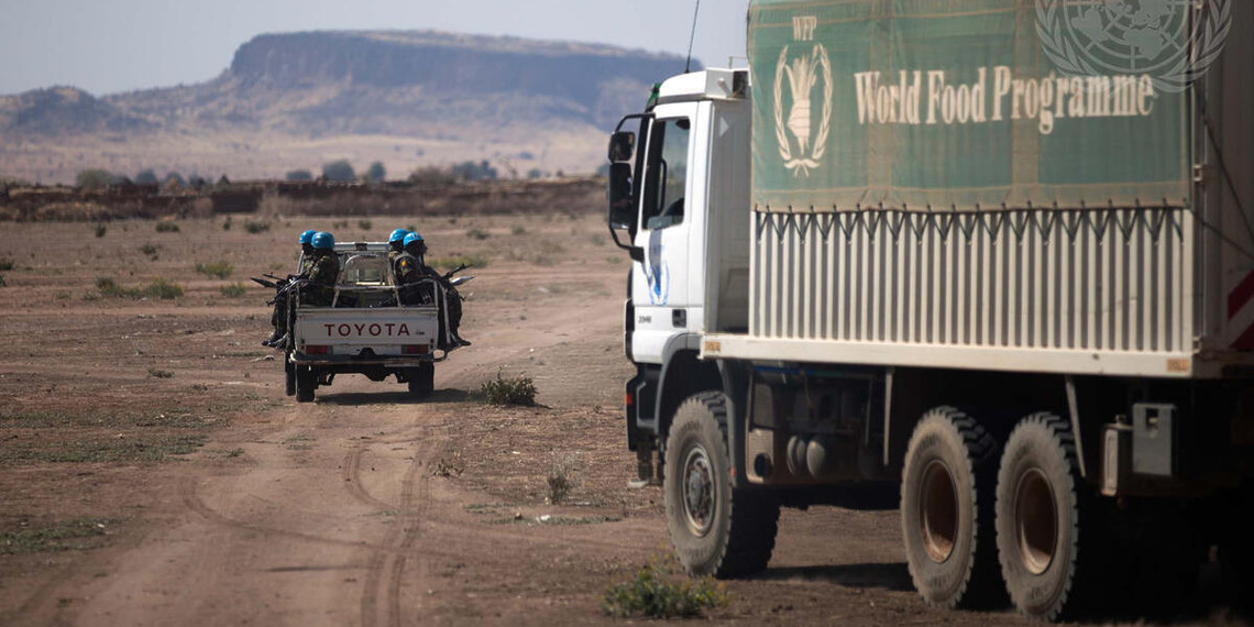Ethiopian peacekeepers serving with the African Union/UNAMID escort World Food Programme trucks