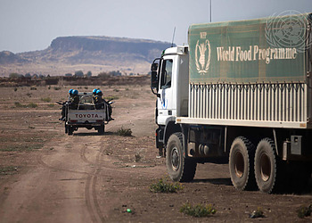Ethiopian peacekeepers serving with the African Union/UNAMID escort World Food Programme trucks
