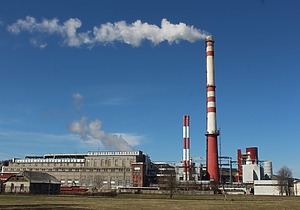 Industrial plant emitting exhaust from smokestacks