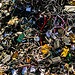 Tangled electronic waste, including cables and chargers.