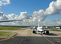 A picture of airplanes lined up at the runway at Heathrow Airport.