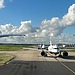 A picture of airplanes lined up at the runway at Heathrow Airport.