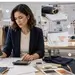Apparel production specialist reviewing production documents