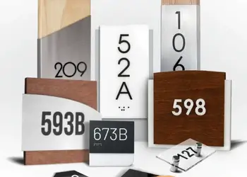 Collection of personalized room signs in wood, acrylic, brushed metal and glass