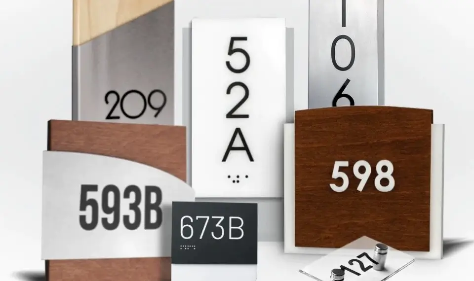 Collection of personalized room signs in wood, acrylic, brushed metal and glass