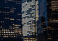 City buildings illuminated at night.