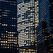 City buildings illuminated at night.