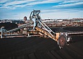 Machinery processing coal at a stockpile site.